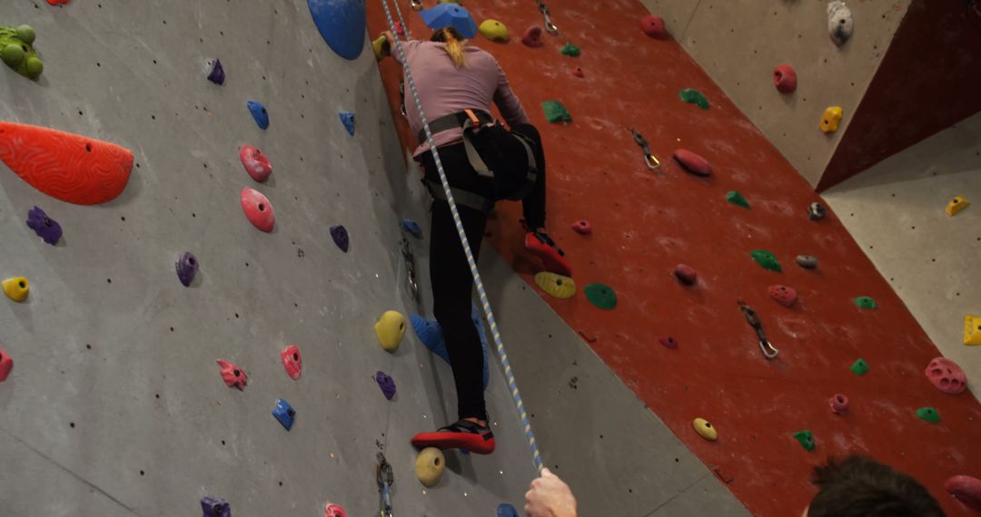 Woman Climbing Indoor Rock Wall for Vertical Challenge Activity - Free Images, Stock Photos and Pictures on Pikwizard.com