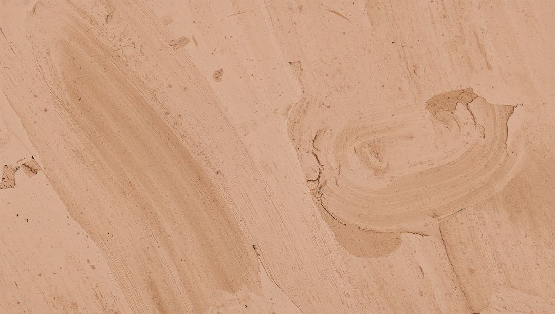 Beige Plaster Wall Featuring Broad Trowel Strokes, Circular Swirl Patch, Chipped Stucco