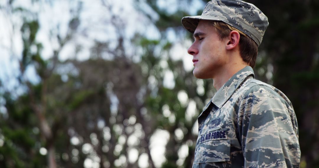A young Caucasian male in an Air Force uniform stands outdoors, with copy space - Free Images, Stock Photos and Pictures on Pikwizard.com