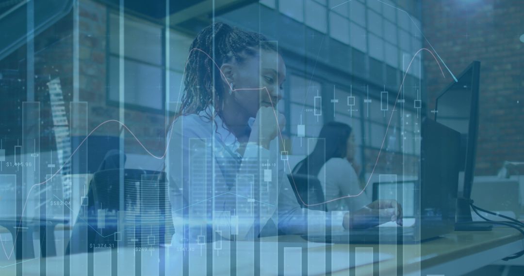 Black Woman Analyzing Financial Data in Modern Office Setting