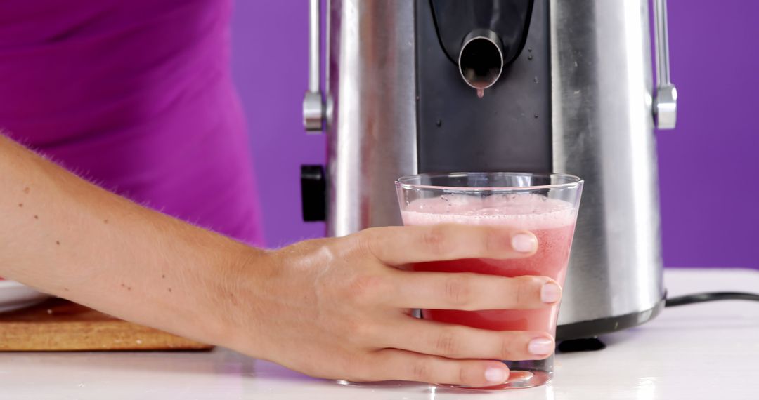 Person making fresh juice with a juicer - Free Images, Stock Photos and Pictures on Pikwizard.com