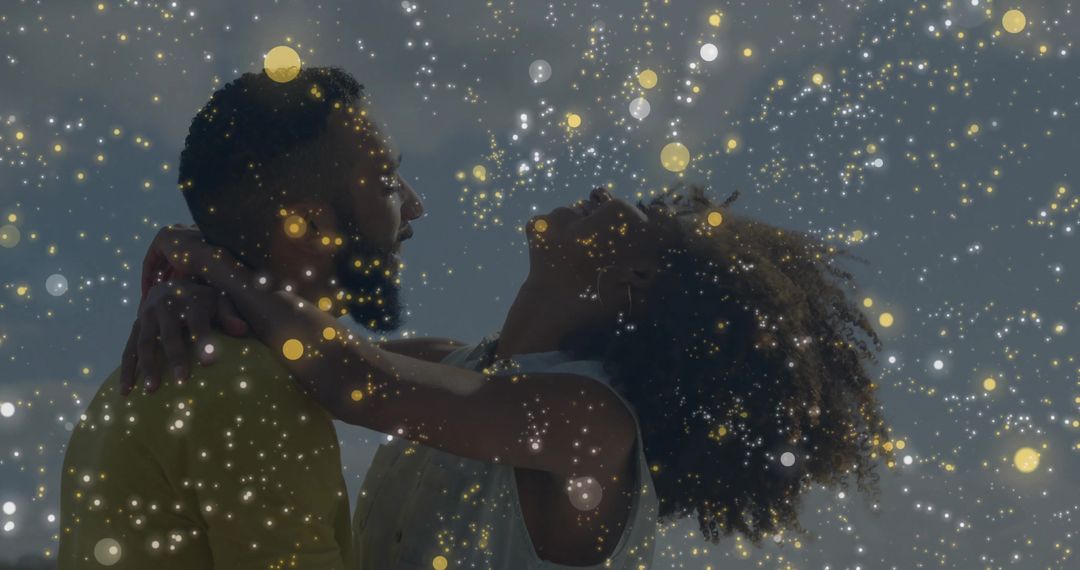 Joyful Couple Embracing under Magical Light Particles