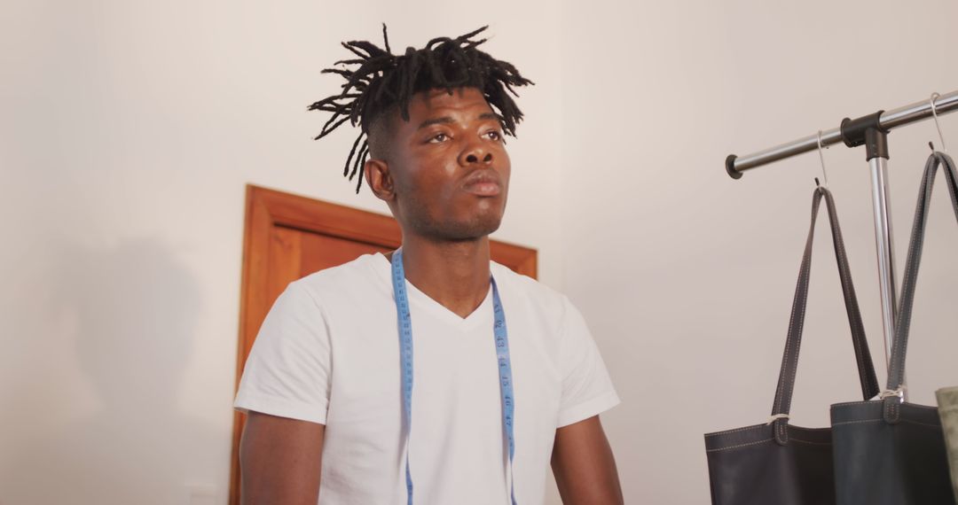 Craftsman Organizing Leather Goods in Workshop