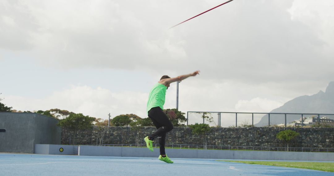 Athlete Throwing Javelin on Outdoor Track and Field - Free Images, Stock Photos and Pictures on Pikwizard.com