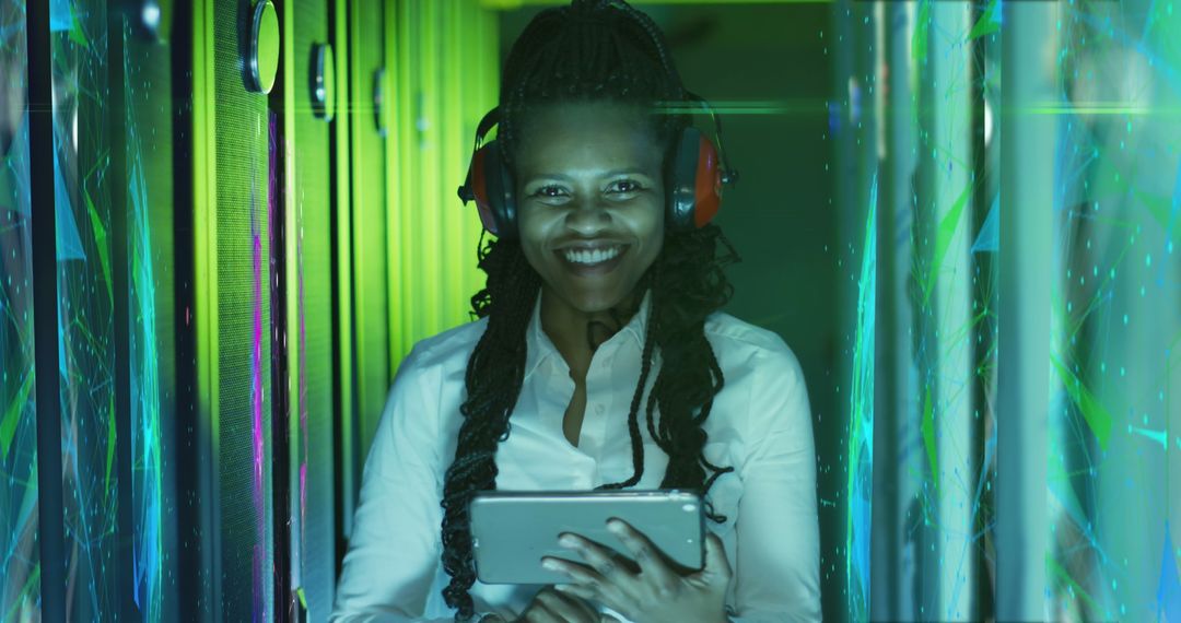 African American IT Engineer Managing Data Servers with Tablet