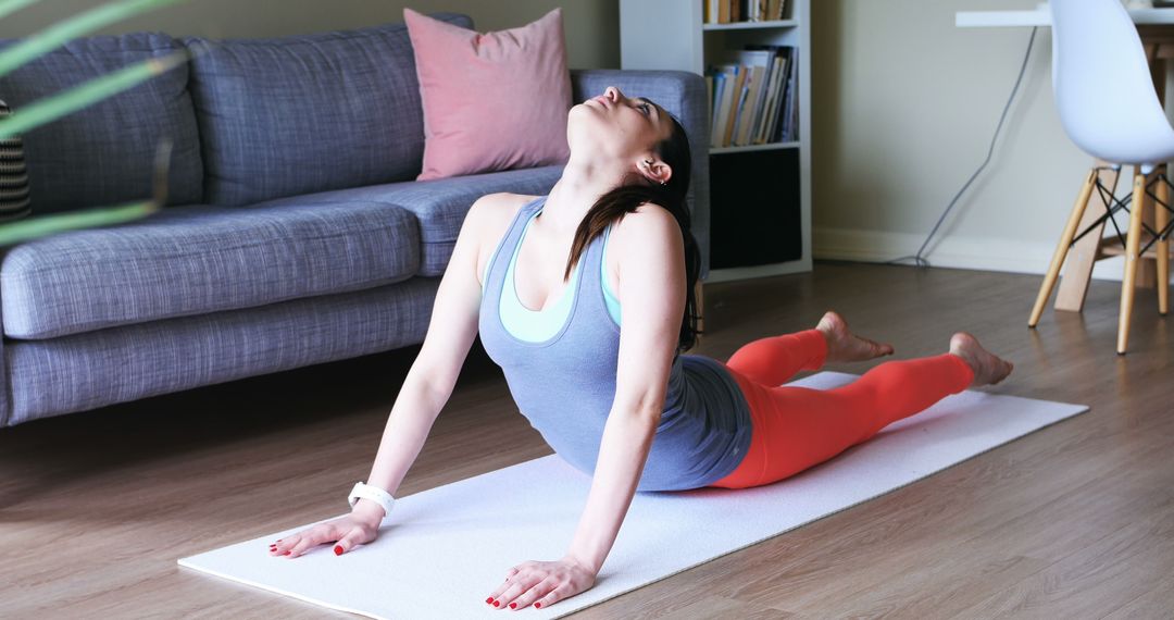 Woman Practicing Yoga in Living Room Wearing Activewear - Free Images, Stock Photos and Pictures on Pikwizard.com