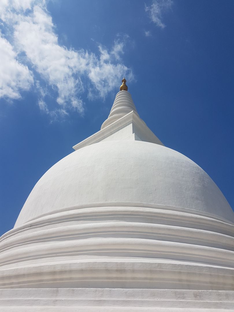 Majestic White Pagoda against Clear Blue Sky on Sunny Day - Free Images, Stock Photos and Pictures on Pikwizard.com