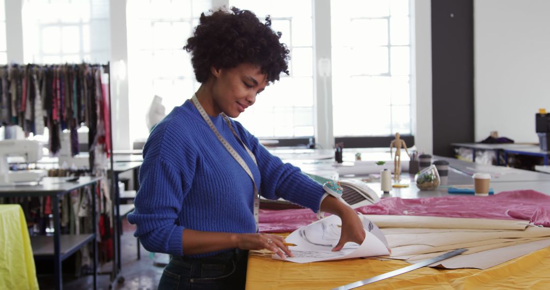 Fashion Designer Examining Fabric in Studio - Free Images, Stock Photos and Pictures on Pikwizard.com