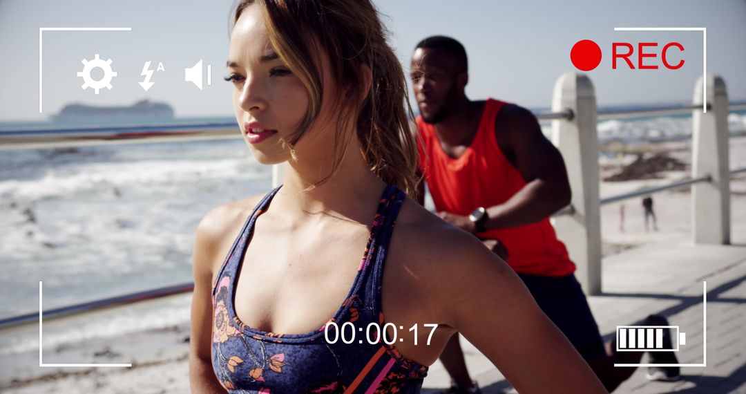 Young Athletes Exercising on Beach Captured by Digital Camera