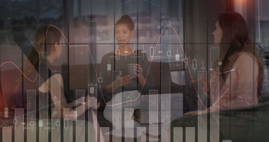 Diverse Female Team Analyzing Data in Modern Office Environment