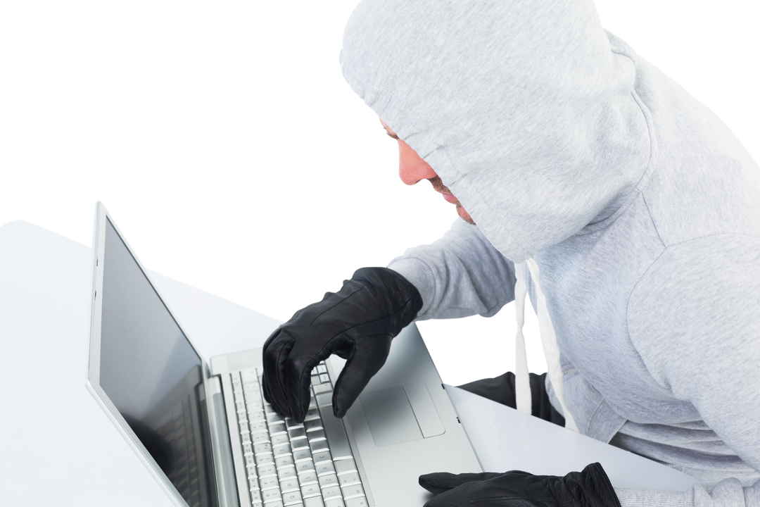 Hacker wearing gray sweatshirt and black gloves using laptop, transparent background - Download Free Stock Images Pikwizard.com