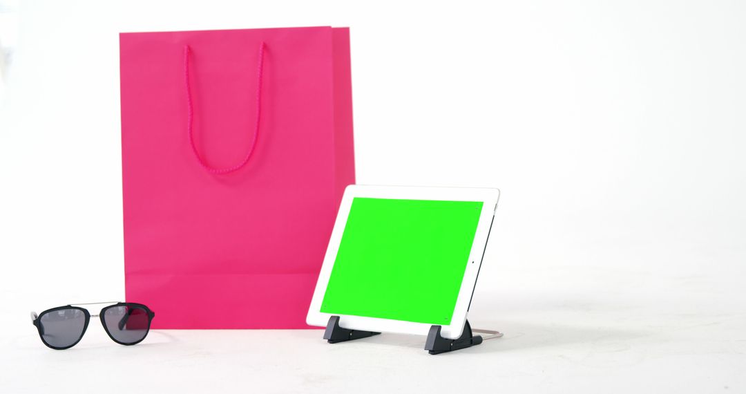 Mockup with Tablet, Pink Shopping Bag and Sunglasses on White Background - Free Images, Stock Photos and Pictures on Pikwizard.com