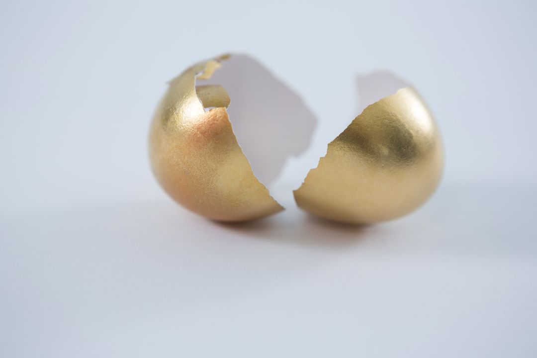 Broken golden Easter egg on white background - Free Images, Stock Photos and Pictures on Pikwizard.com