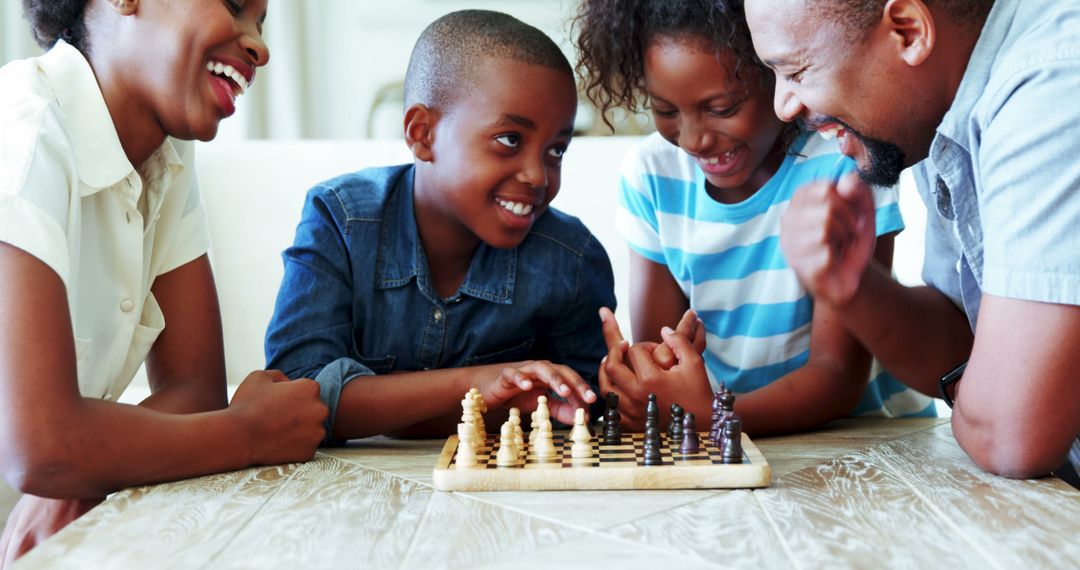 Happy Family Playing Chess at Home - Free Images, Stock Photos and Pictures on Pikwizard.com