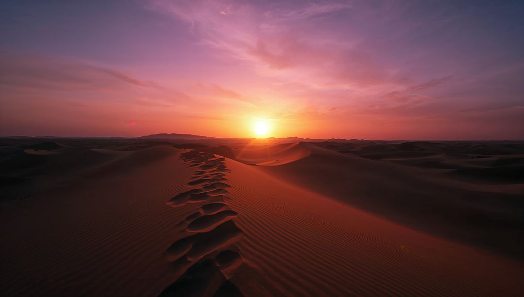 Tranquil Sunset Over Sand Dunes in Expansive Desert Landscape