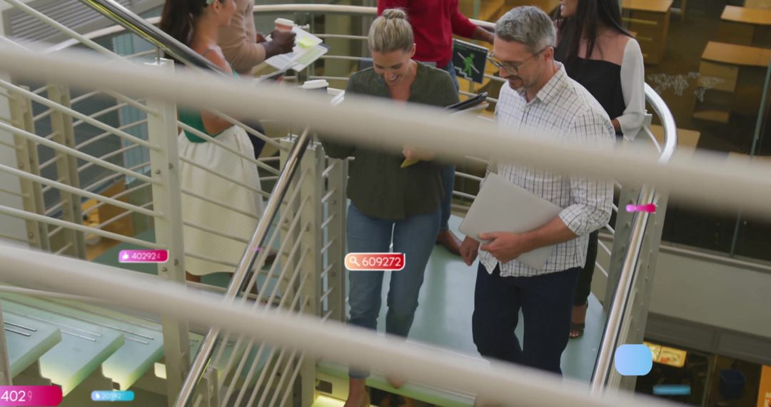 Colleagues Collaborating on Spacious Office Staircase