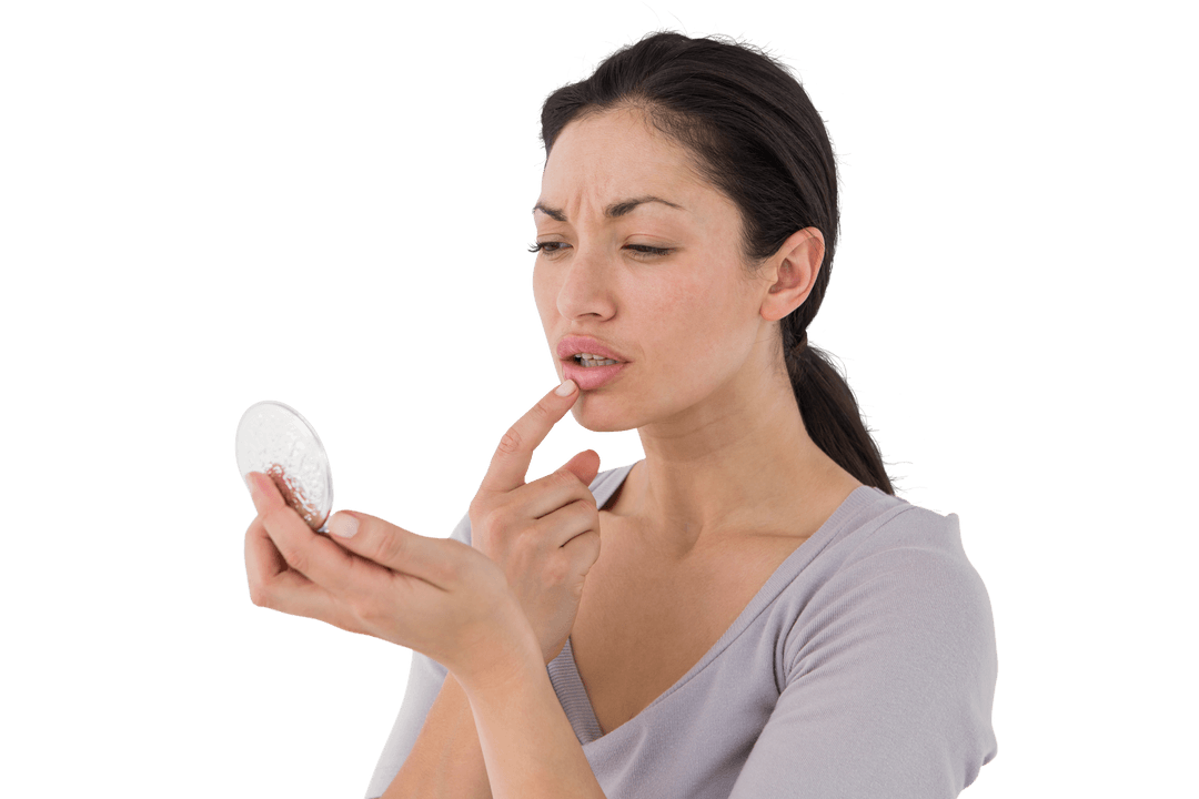 Worried Woman Examining Lips with Transparent Compact Mirror