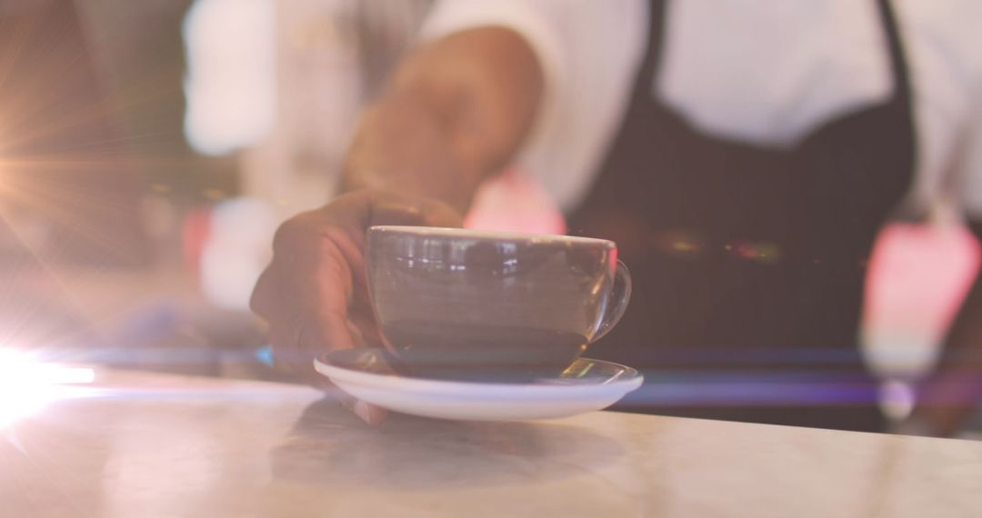 Barista Serves Fresh Brewed Coffee with Warm Glowing Light