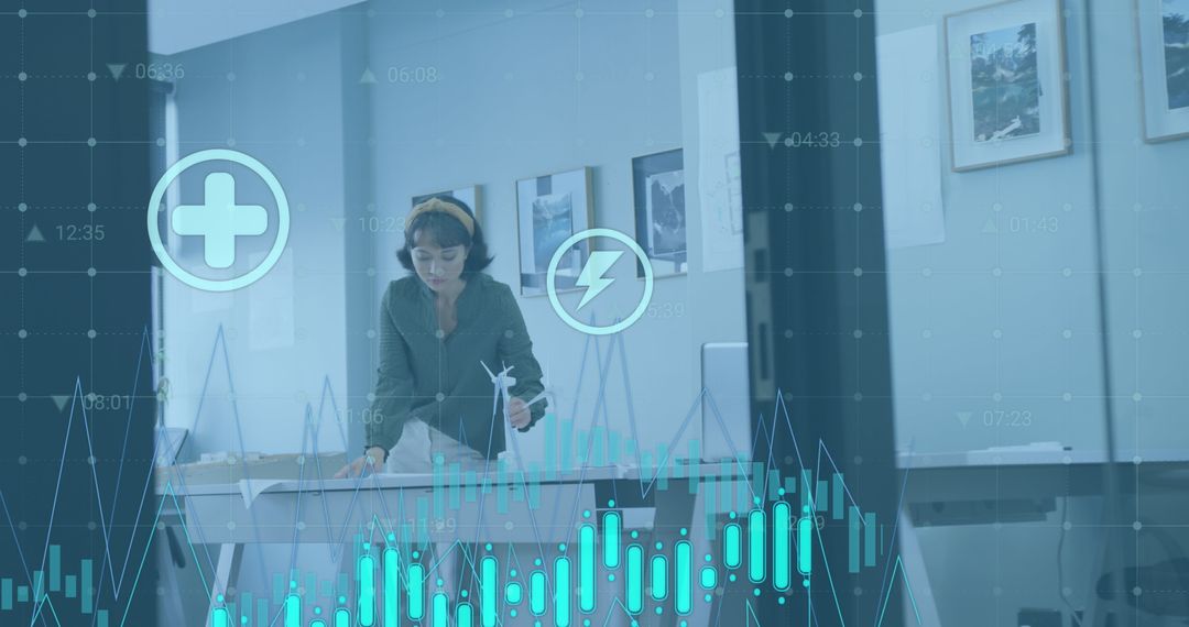 Businesswoman Analyzing Graphs with Digital Interface