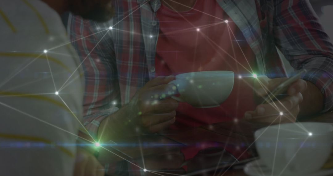 Friends Connecting Digitally Over Coffee in Casual Setting