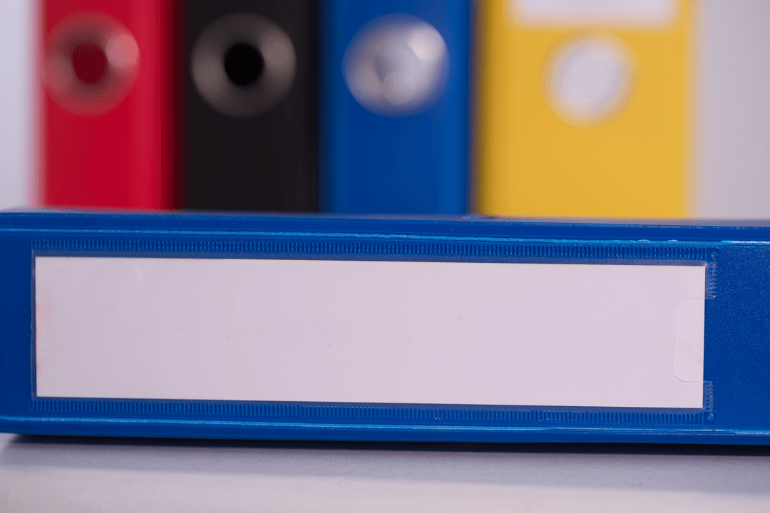 Colorful Transparent Binder Collection on Desk