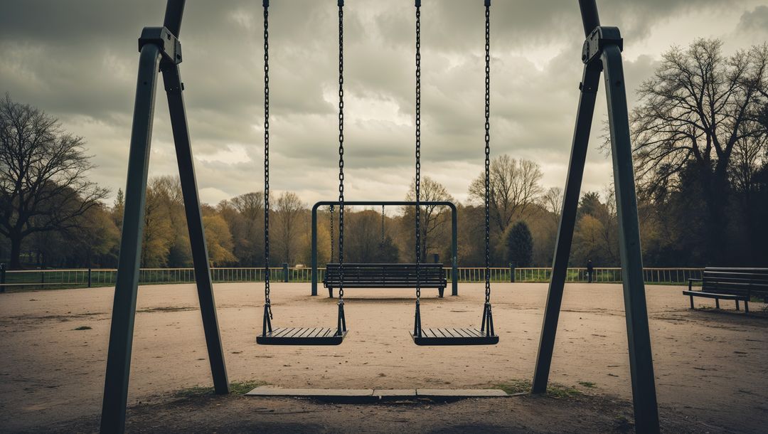 Empty Swing Set in Quiet Park during Overcast Day