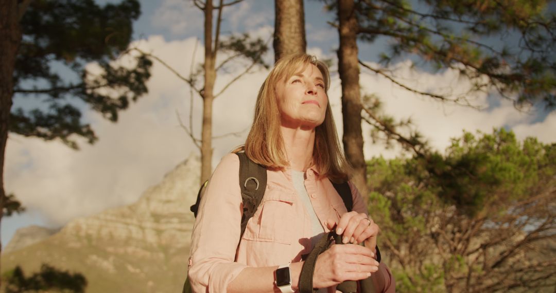 Woman Enjoying a Peaceful Hike in Mountainous Forest - Free Images, Stock Photos and Pictures on Pikwizard.com