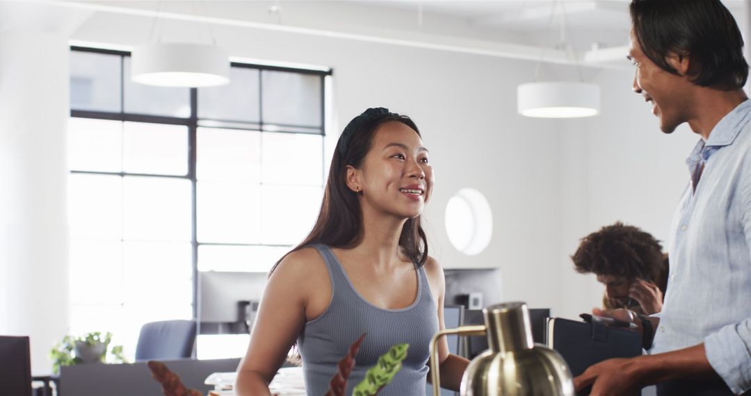 Multicultural Colleagues Discussing Ideas in Modern Office Environment