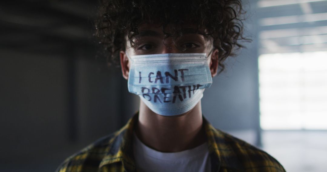 Young Man Wearing 'I Can't Breathe' Mask in Solidarity - Free Images, Stock Photos and Pictures on Pikwizard.com