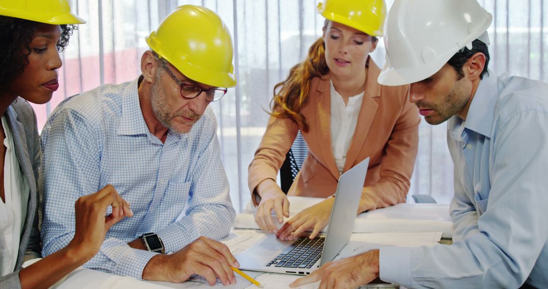 Construction Professionals Collaborating on Blueprint Plans - Free Images, Stock Photos and Pictures on Pikwizard.com