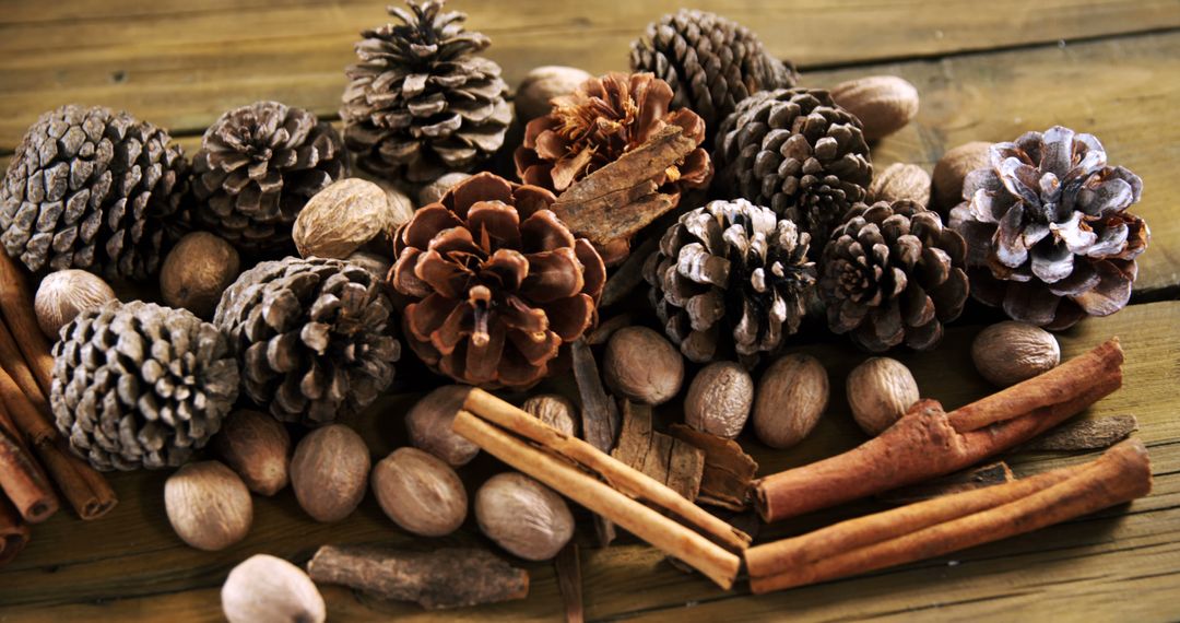 Autumnal and winter decorations featuring pine cones, cinnamon, and nuts exude rustic warmth. - Free Images, Stock Photos and Pictures on Pikwizard.com