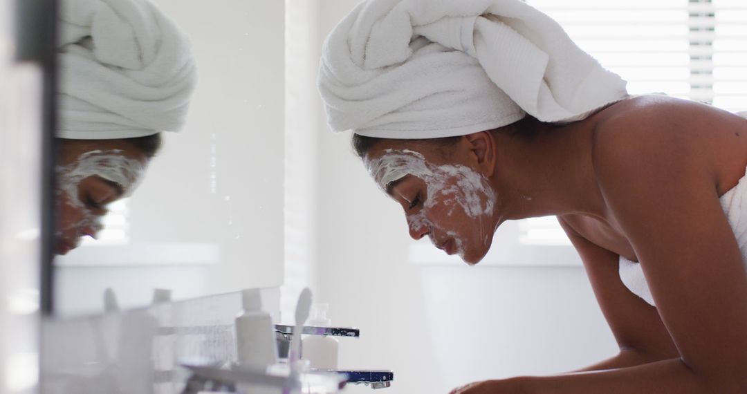 Woman Skincare Routine in Bathroom Wearing Towel Head Wrap - Free Images, Stock Photos and Pictures on Pikwizard.com