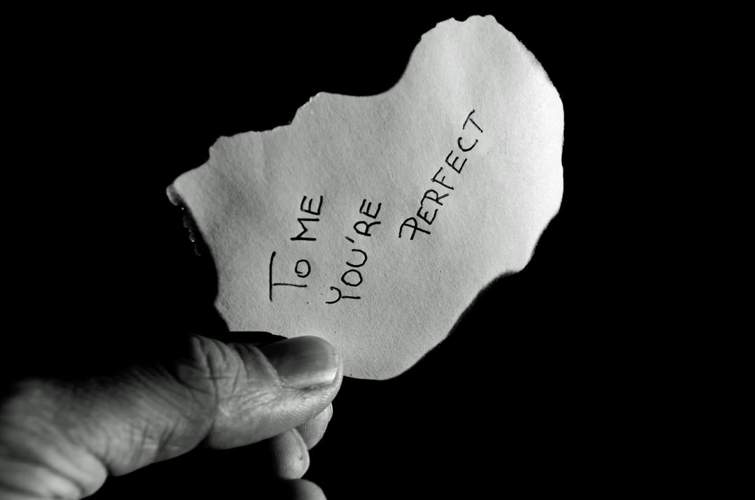 Hand Holding Paper with Romantic Message in Black and White - Free Images, Stock Photos and Pictures on Pikwizard.com