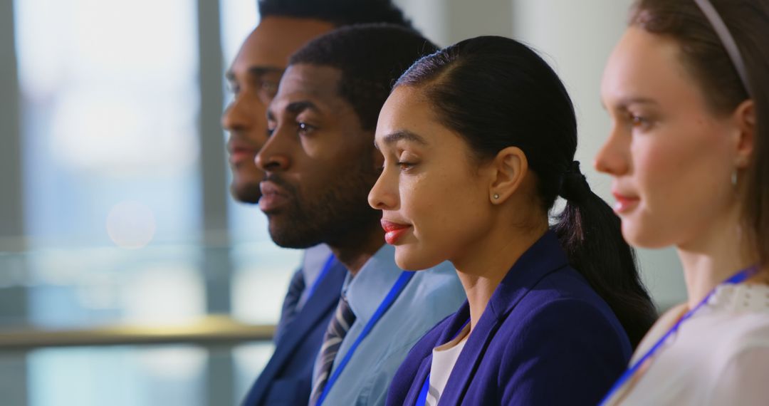 Diverse Colleagues Standing In Unity Inside Office Space
