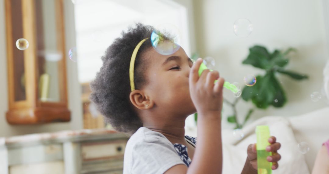 Child Blowing Bubbles Indoors Joyful Playtime