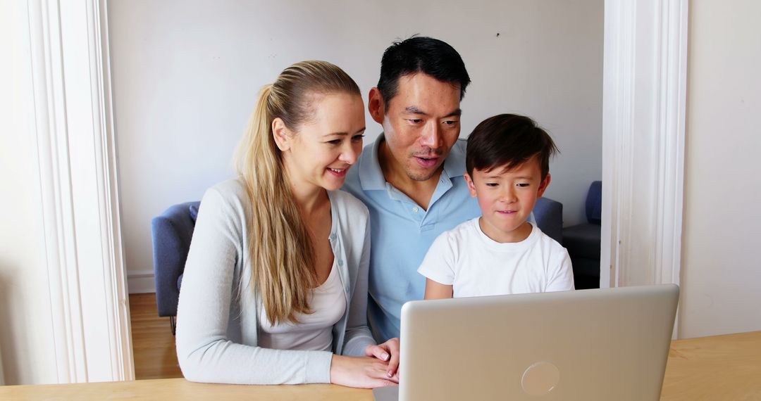 Happy Multiracial Family Using Laptop at Home - Free Images, Stock Photos and Pictures on Pikwizard.com