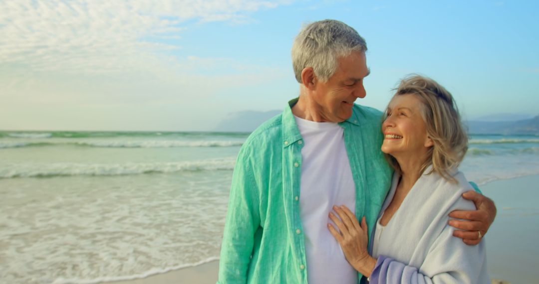 Senior Couple Embracing on Scenic Beach
