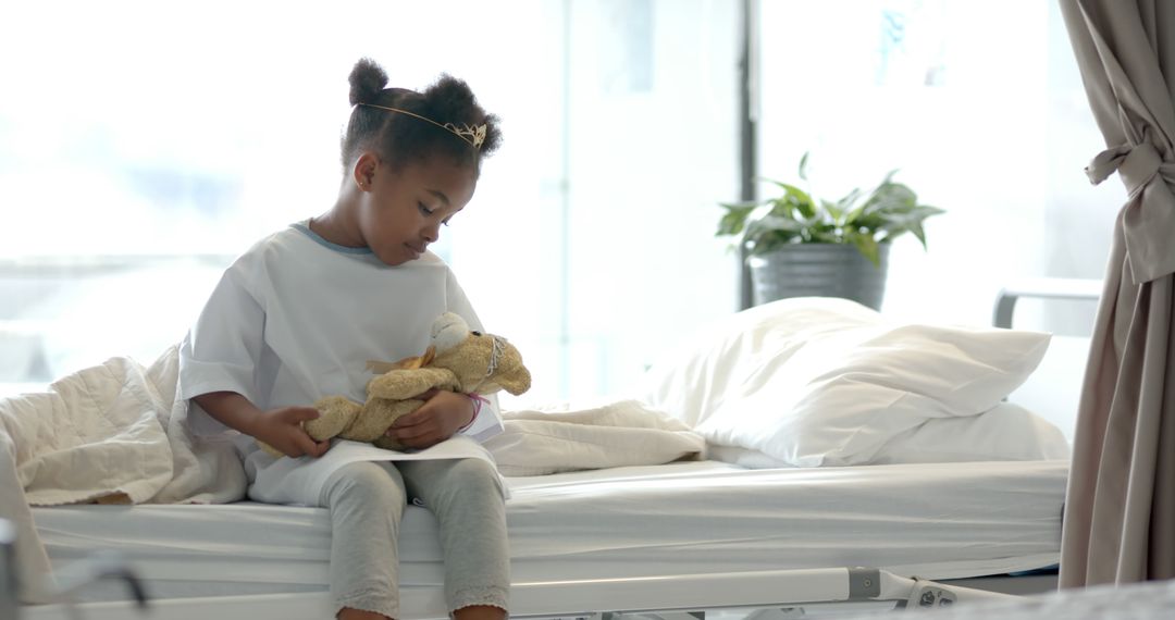 Little Girl in Hospital Bed Holding Stuffed Animal - Free Images, Stock Photos and Pictures on Pikwizard.com