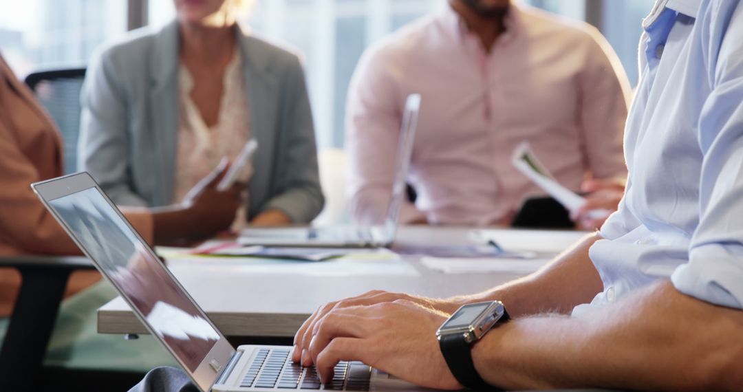 Professional Meeting with Laptop Usage in Office Setting