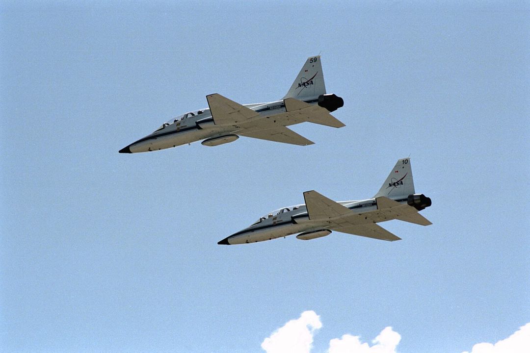 Two T-38 Jets Flying Over Space Center During Training Drill - Free Images, Stock Photos and Pictures on Pikwizard.com
