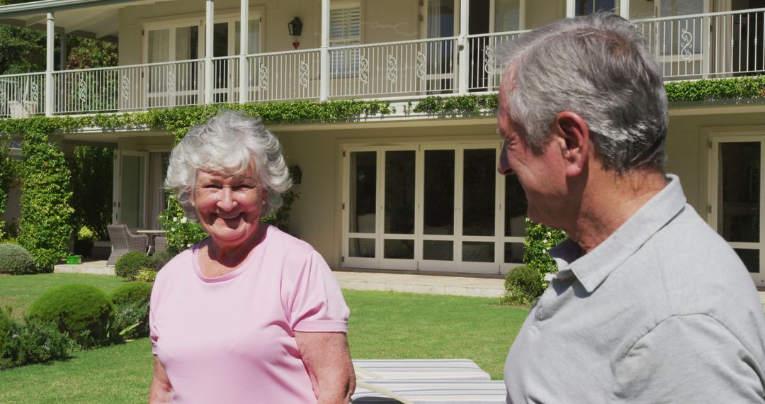 Portrait of happy caucasian senior couple smiling in garden standing in the sun - Free Images, Stock Photos and Pictures on Pikwizard.com