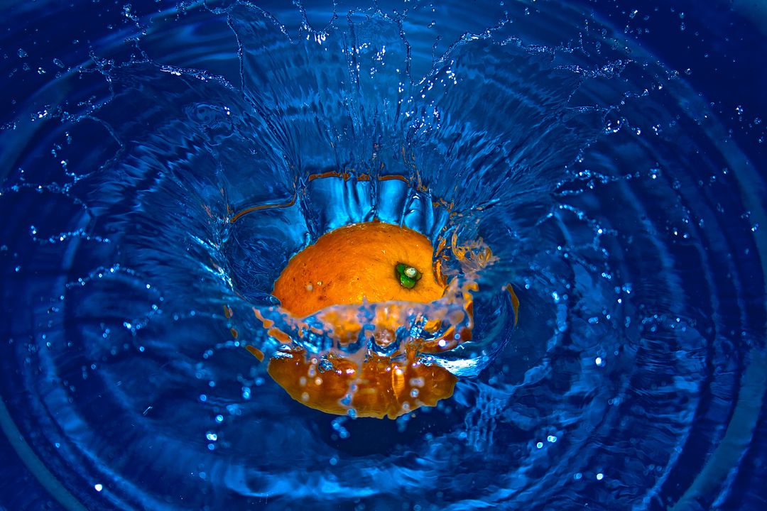 Orange Drop in Water in Time Laps Photography - Free Images, Stock Photos and Pictures on Pikwizard.com