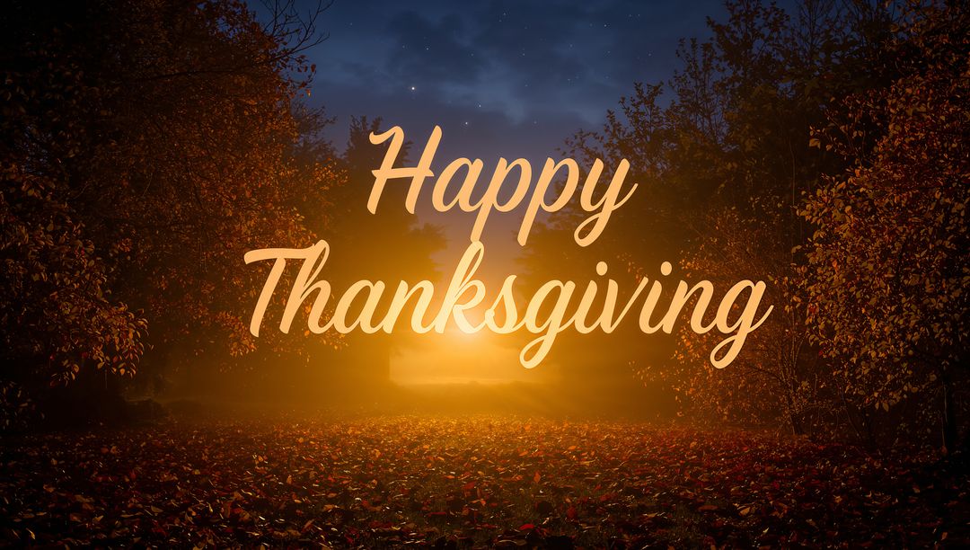Glowing Autumn Forest Clearing with Happy Thanksgiving Script Bathed in Golden Mist