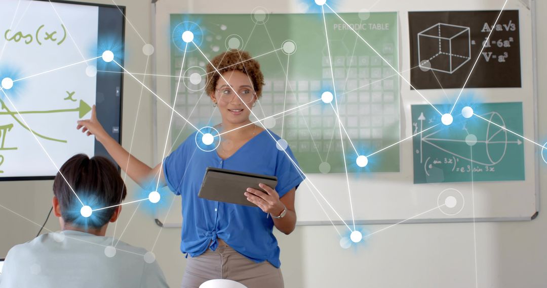Female Instructor Pointing at Cosine Graph Holding Tablet with Digital Network Overlay