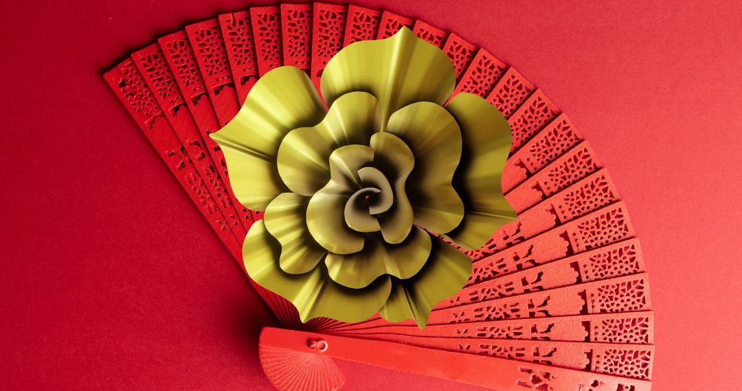 Chinese Inspired Fan with Metallic Flower on Red Background - Free Images, Stock Photos and Pictures on Pikwizard.com