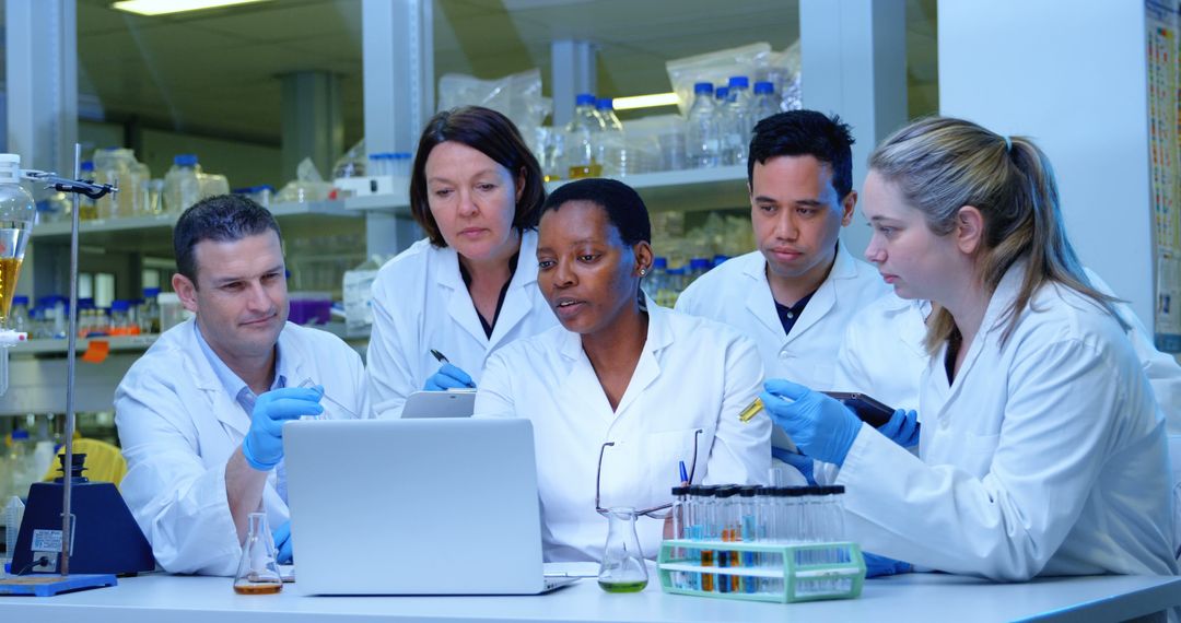 Diverse team of scientists working together in a lab - Free Images, Stock Photos and Pictures on Pikwizard.com