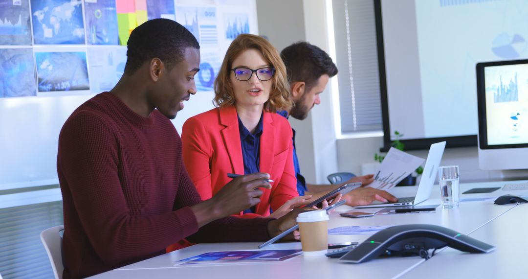 Multicultural Team Collaborating in Modern Office with Technology