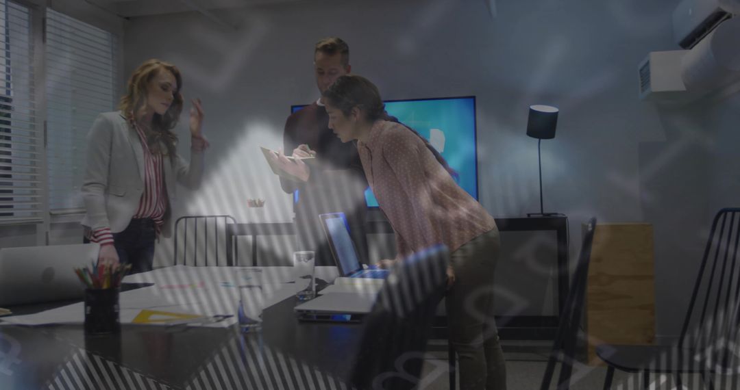 Business Team Collaborating on Data in Office Meeting Room