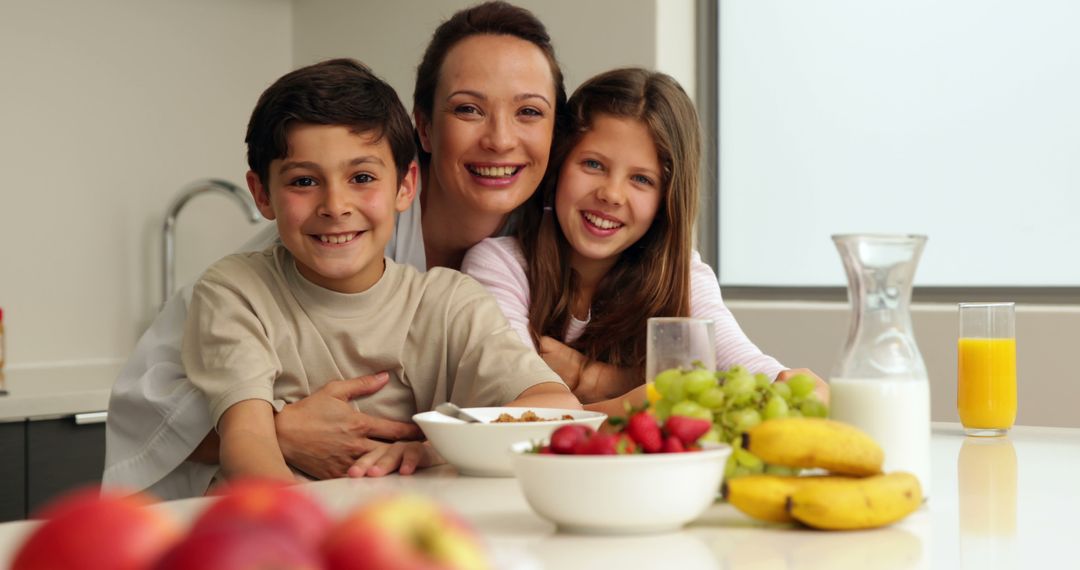 Happy Family Enjoying Healthy Breakfast in Modern Kitchen - Free Images, Stock Photos and Pictures on Pikwizard.com