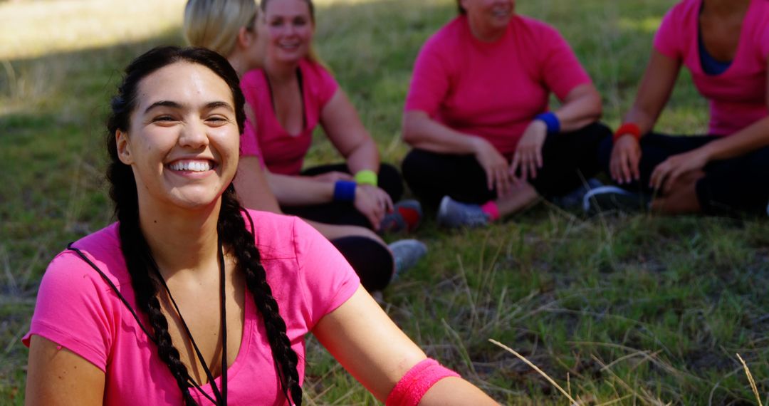 Group of Happy Women in Pink Exercising Outdoors - Free Images, Stock Photos and Pictures on Pikwizard.com